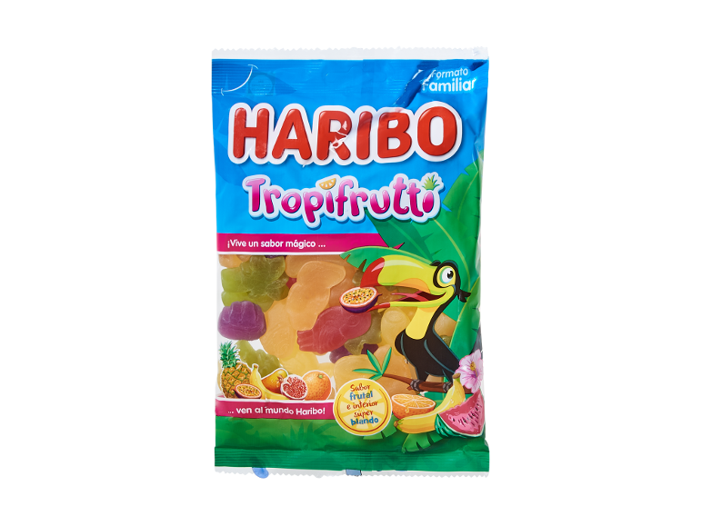 Caramelle gommose al gusto di frutta tropicale in una confezione formato famiglia, con tucano e vari frutti.