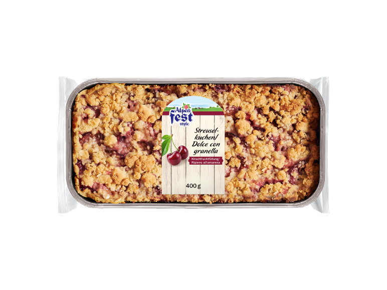 Teglia da forno con torta di ciliegie sbriciolata, etichettata 'Streuselkuchen/Dolce con granella' e '400 g'.
