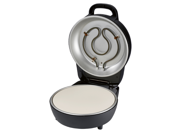 Forno elettrico per pizza aperto con pietra ceramica ed elemento riscaldante.