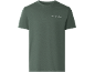 Maglietta verde a maniche corte con la scritta 'Thrive in the unknown'.
