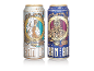 Due lattine di birra con illustrazioni in stile steampunk: una Session IPA e una Wheat Pale Ale.