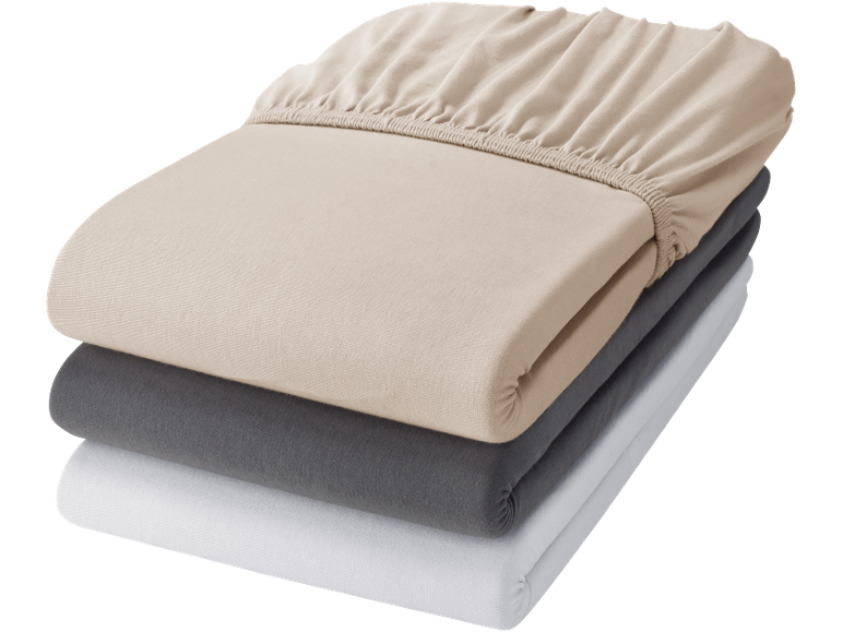 Pila di tre lenzuola con angoli in beige, grigio e bianco