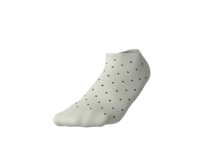Calzino alla caviglia bianco a pois neri.
