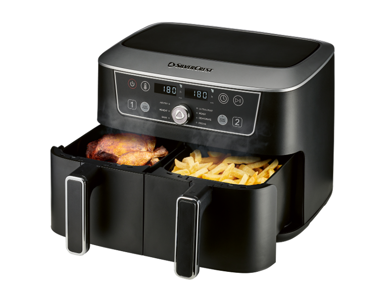 Friggitrice ad aria nera a doppio cestello che cucina pollo e patatine, con display digitale.