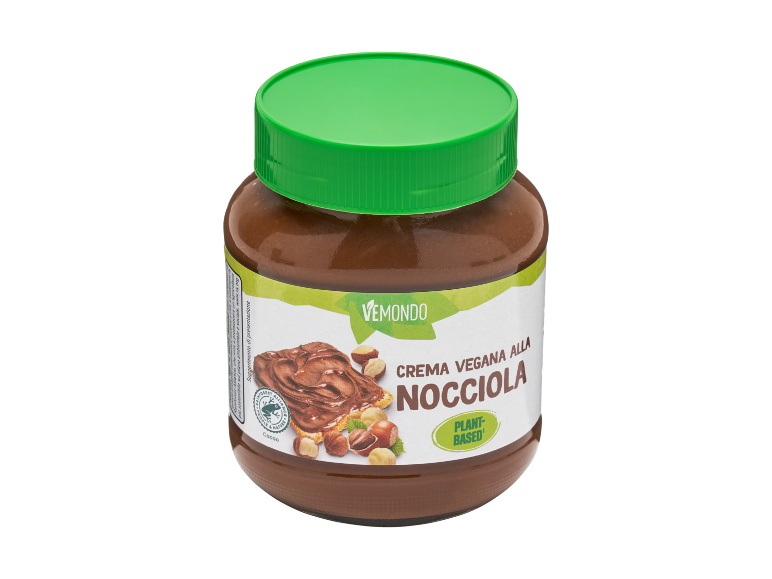 Crema vegana alla nocciola in un vasetto con tappo verde, etichettata 'Plant-Based'.