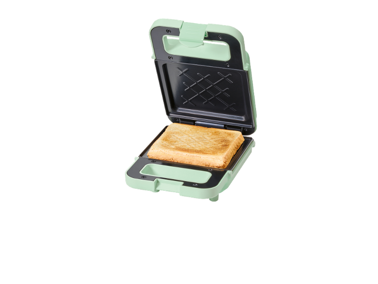 Tostapane verde con un toast all'interno