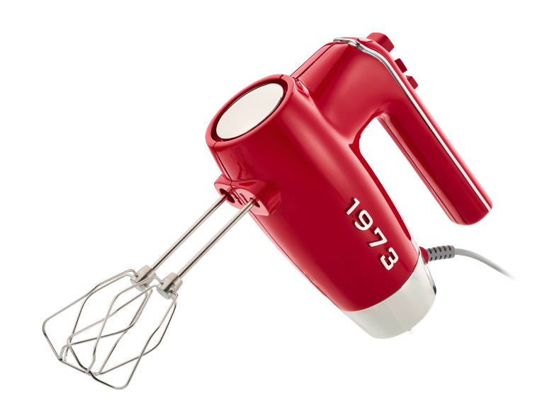 Sbattitore manuale rosso con fruste e testo '1973' sul lato.