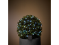 Arbusto decorativo con luci LED solari in una stanza buia.