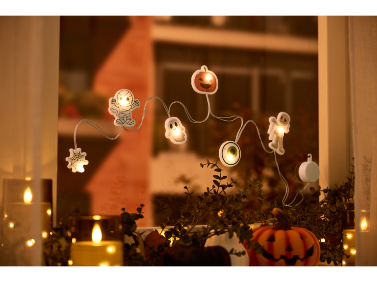 Luci a stringa di Halloween con forme di mummia, fantasma, zucca e bulbo oculare, con candele.