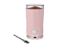 Macinacaffè rosa con caffè macinato e spazzola per la pulizia.