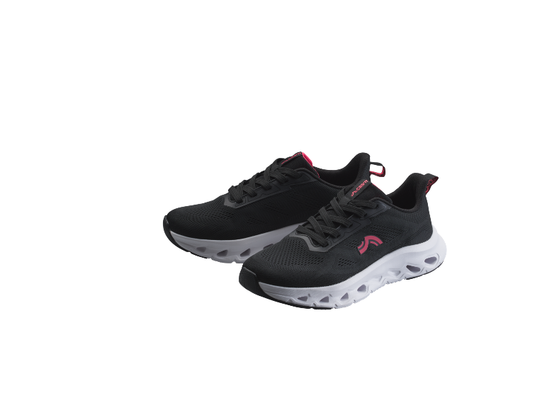 Paio di scarpe sportive nere e rosa con suole bianche
