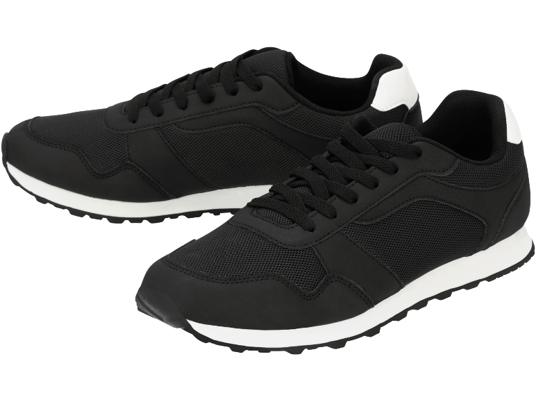 Scarpe da ginnastica nere con suole bianche.