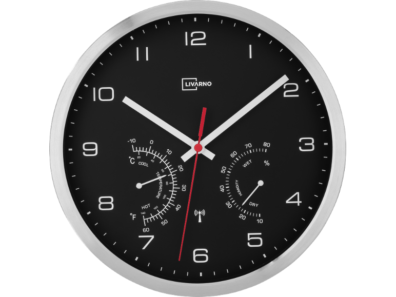Orologio da parete con termometro e igrometro, quadrante nero con numeri e lancette bianche.