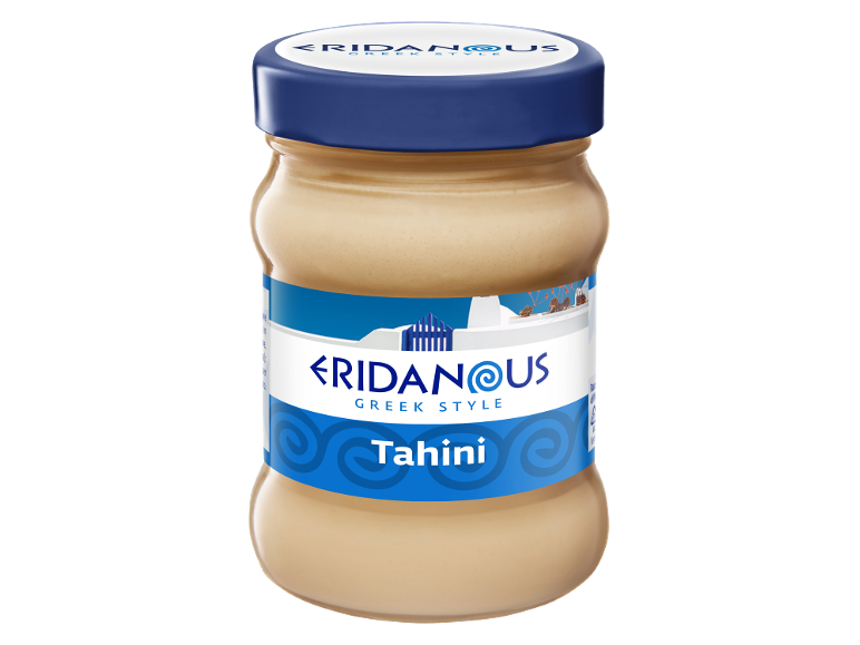 Vasetto di tahini stile greco con tappo blu ed etichetta bianca e blu.