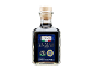 Bottiglia di Aceto Balsamico di Modena IGP invecchiato con etichetta blu.