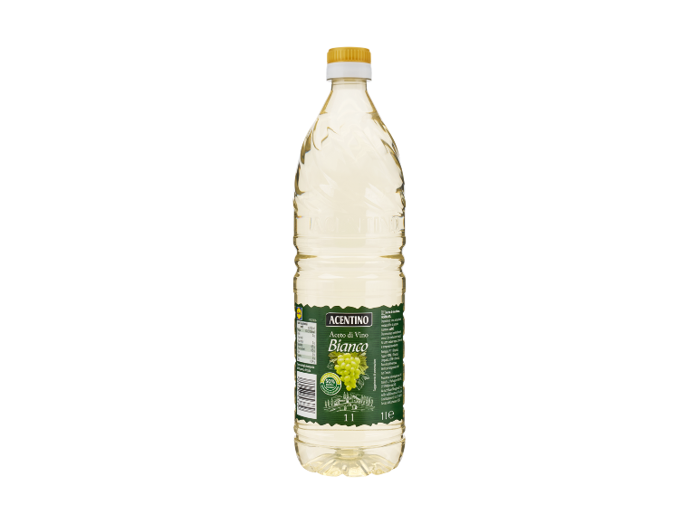 Bottiglia di aceto di vino bianco con etichetta verde e uva