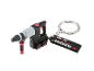 Portachiavi a forma di trapano a percussione con testo 'PERFORMANCE EST. 1996'.