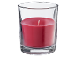 Candela rossa in un bicchiere di vetro.
