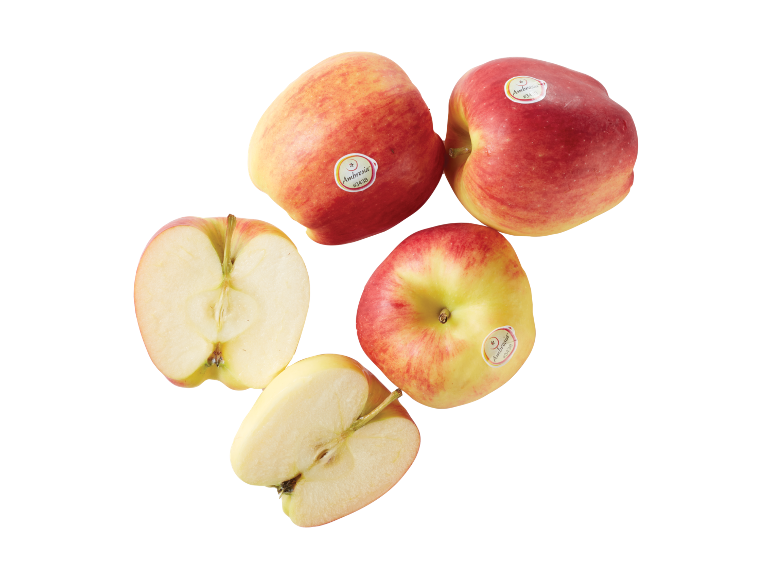 Mele rosse e gialle, alcune tagliate a metà, con adesivi di frutta.