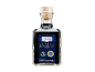 Bottiglia di Aceto Balsamico di Modena IGP invecchiato con etichetta blu.