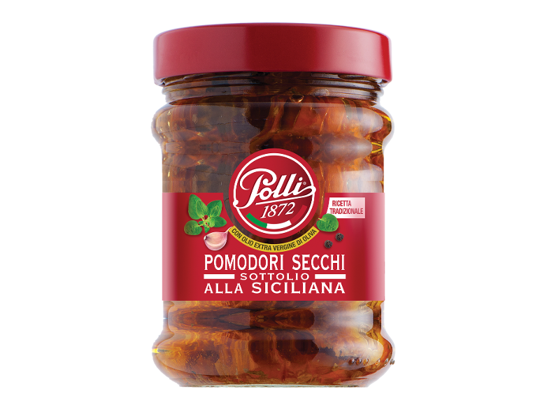 Vaso di pomodori secchi sott'olio con aglio e origano, ricetta tradizionale siciliana.