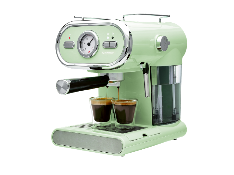 Macchina da caffè espresso retrò verde chiaro che prepara due tazze di caffè.
