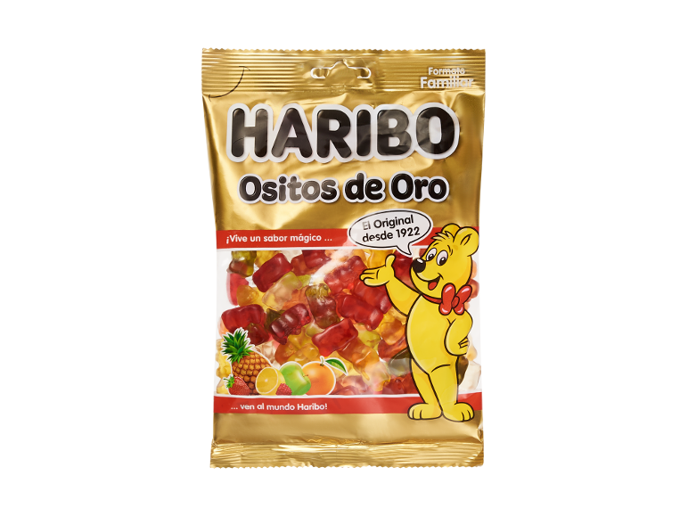 Sacchetto dorato di orsetti gommosi alla frutta con un orsetto gommoso giallo e frutta.