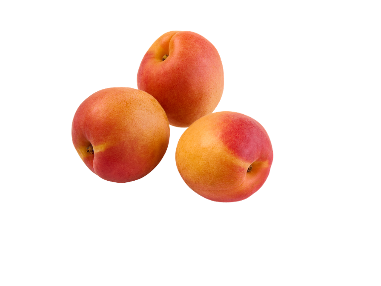 Tre albicocche mature con sfumature rosse e arancioni su sfondo nero