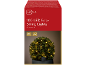 Catena luminosa solare da 100 LED con luce bianca calda, avvolta attorno a un cespuglio verde.