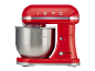 Robot da cucina rosso con ciotola in acciaio inossidabile e il numero 1973 in alto.