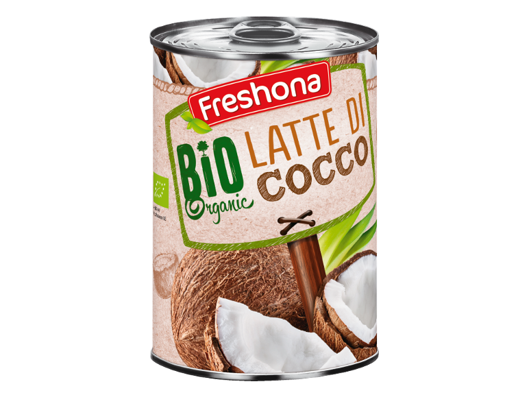 Lattina di latte di cocco biologico con noci di cocco e foglie verdi.