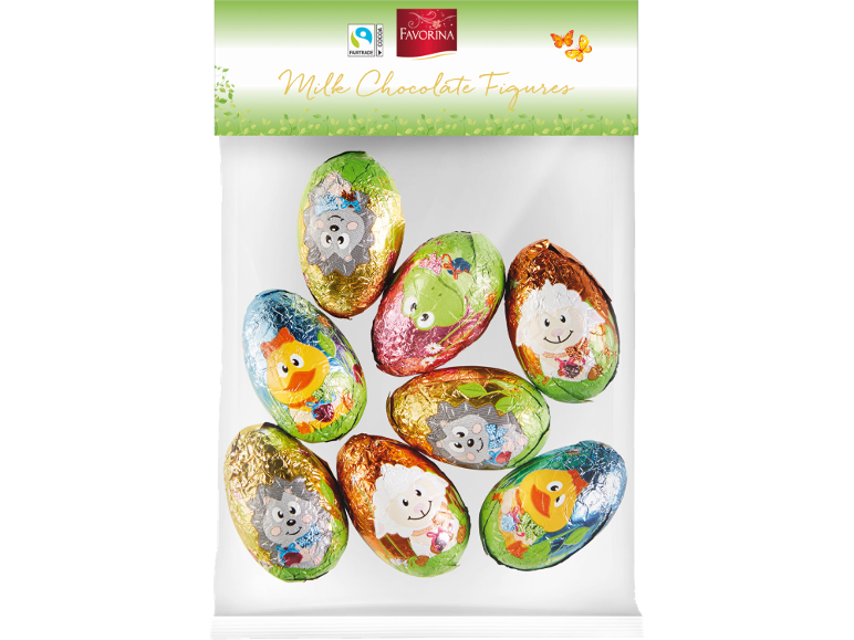 Statuette di cioccolato al latte a forma di uova con animali, avvolte in carta colorata.