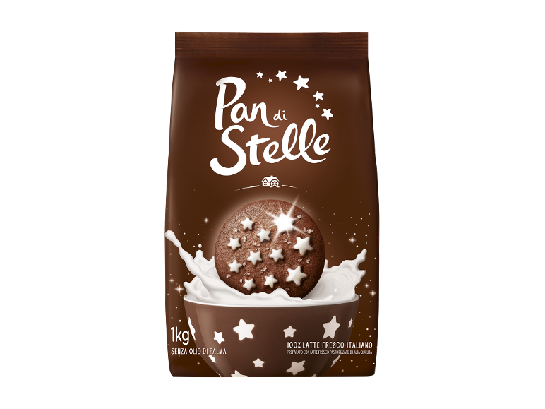 Biscotti al cioccolato con stelle bianche in una ciotola con latte, 1kg.