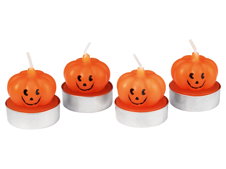 Quattro lumini a forma di zucca di Halloween con faccine sorridenti.
