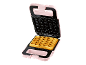 Piastra per waffle rosa con coperchio aperto e un waffle cotto