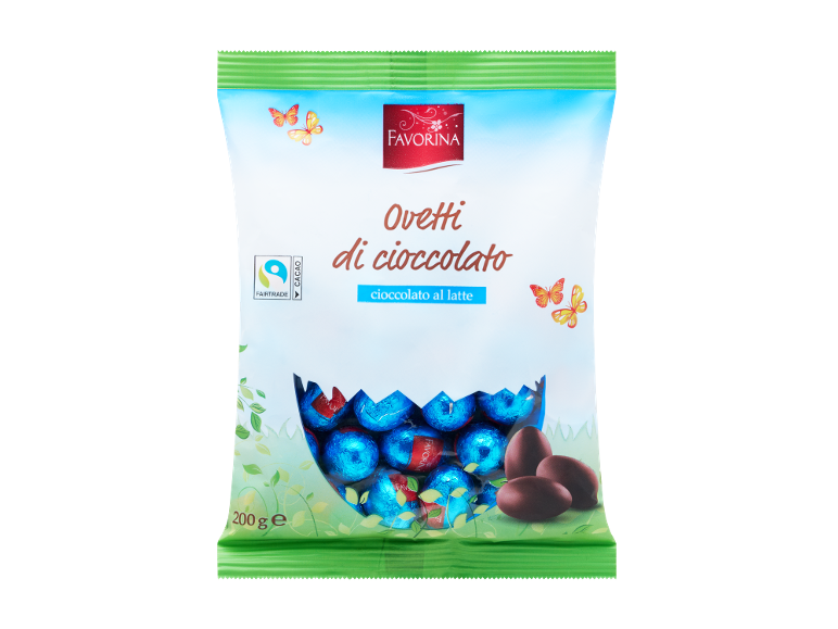 Busta di ovetti di cioccolato al latte con la scritta «Oveti di cioccolato» e il logo Fairtrade.