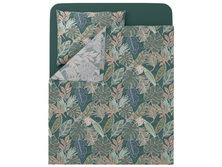 Set copripiumino con cuscino con stampa di foglie tropicali nei toni del verde e del marrone.