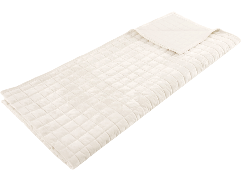Coperta trapuntata color crema con motivo a quadri, piegata per un uso confortevole.