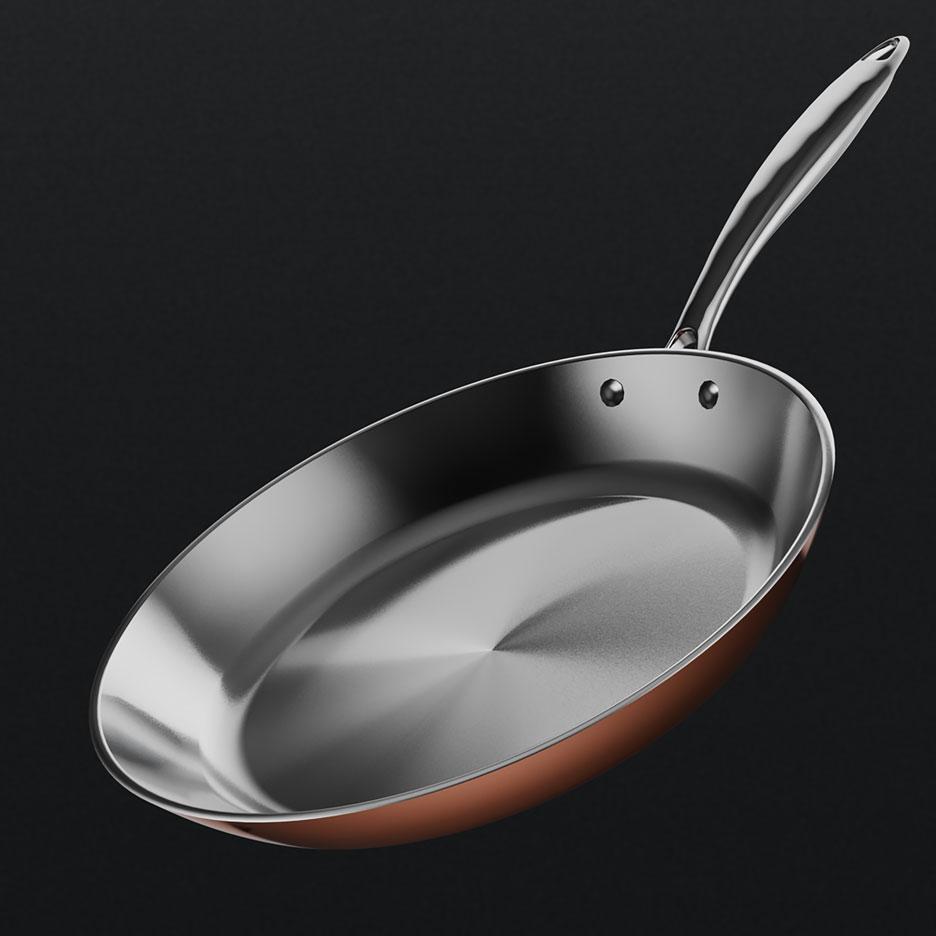 Padella color rame con interno e manico color argento.