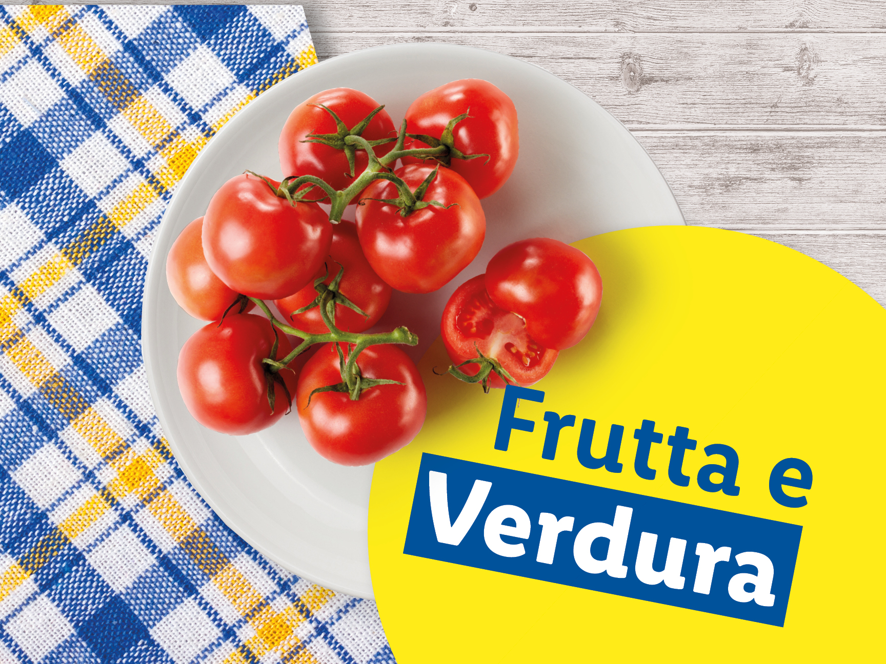 Pomodori freschi su un piatto, con scritta 'Frutta e Verdura'.