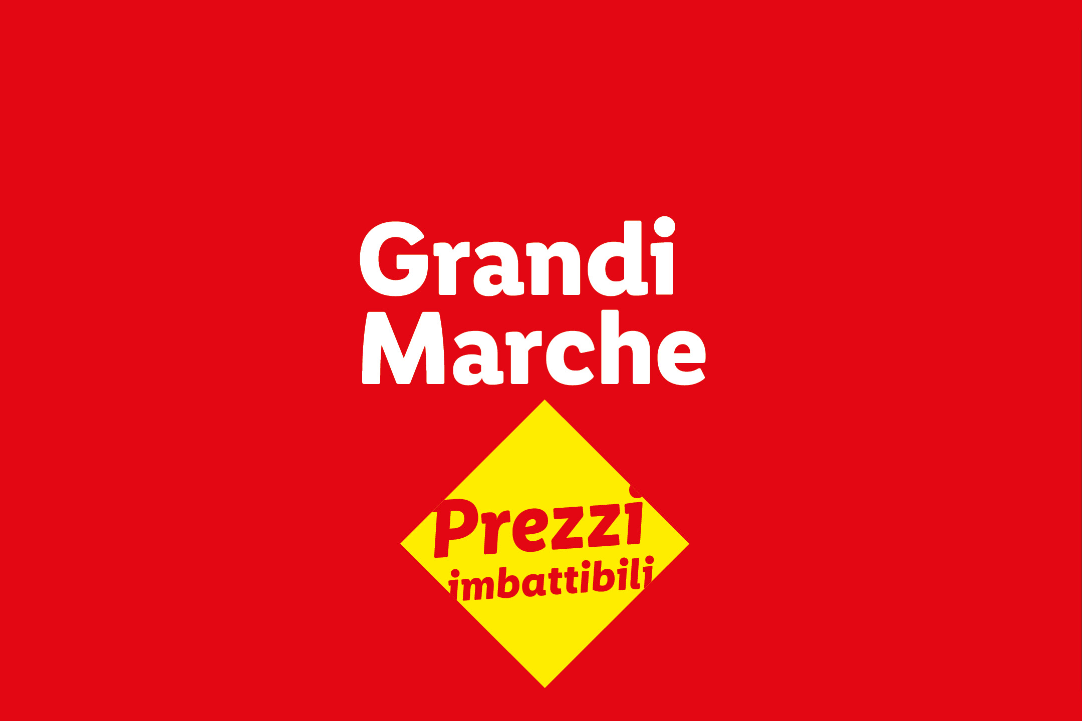 Sfondo rosso con testo bianco 'Grandi Marche' e un rombo giallo con testo rosso 'Prezzi imbattibili'.