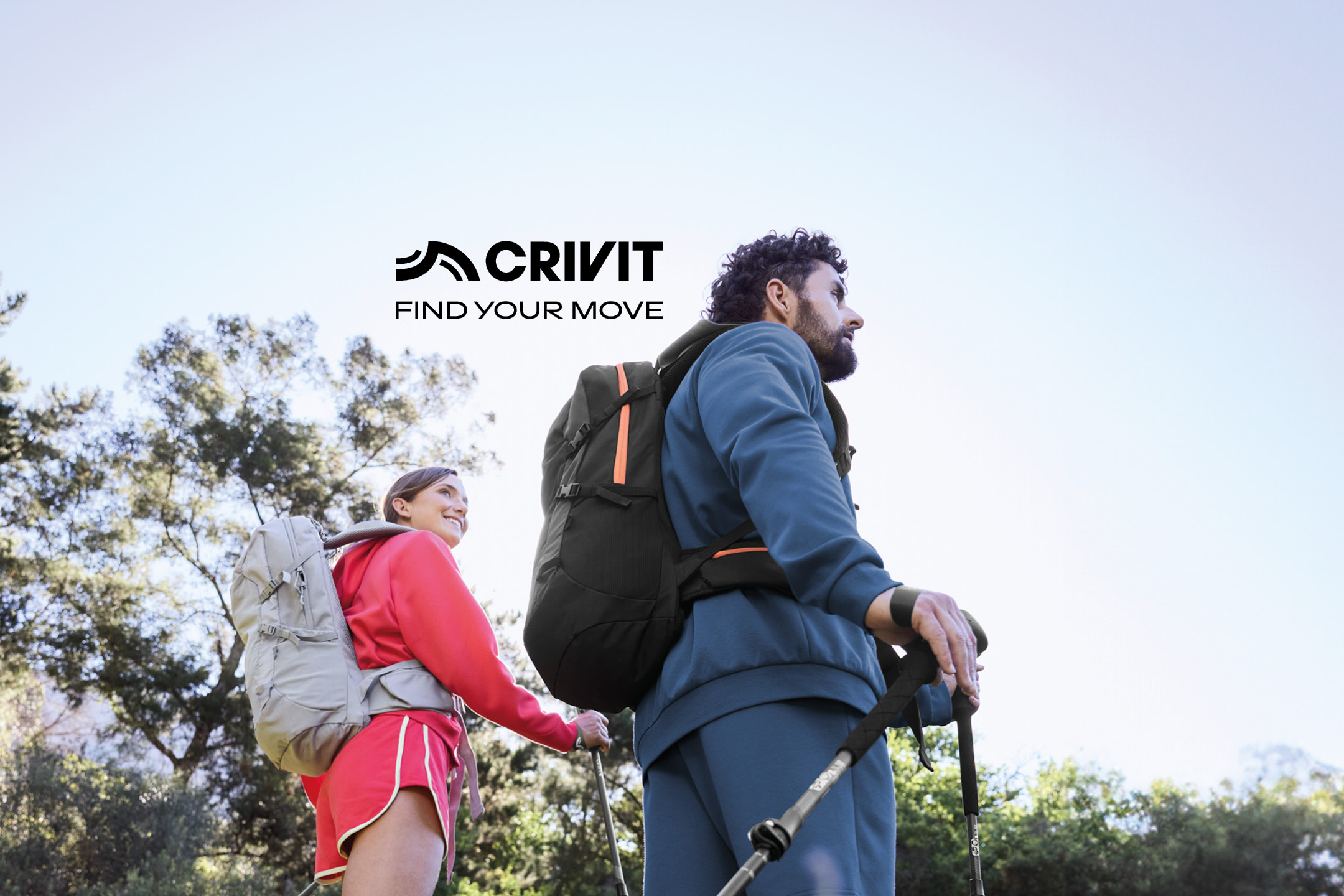 Due escursionisti con zaini e bastoncini da trekking, con il testo 'FIND YOUR MOVE'.