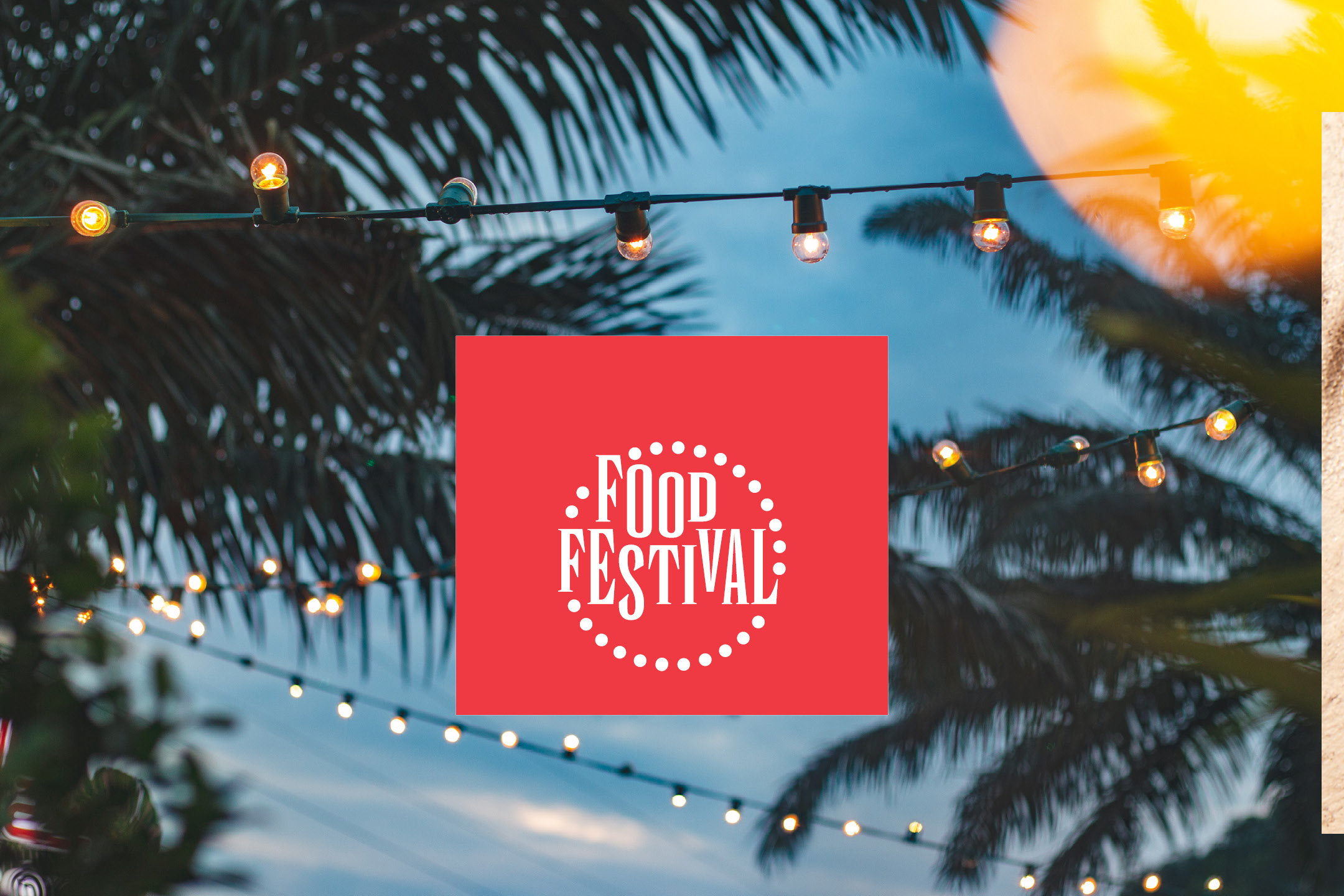 Insegna rossa con la scritta 'Food Festival' su sfondo di palme e luci.