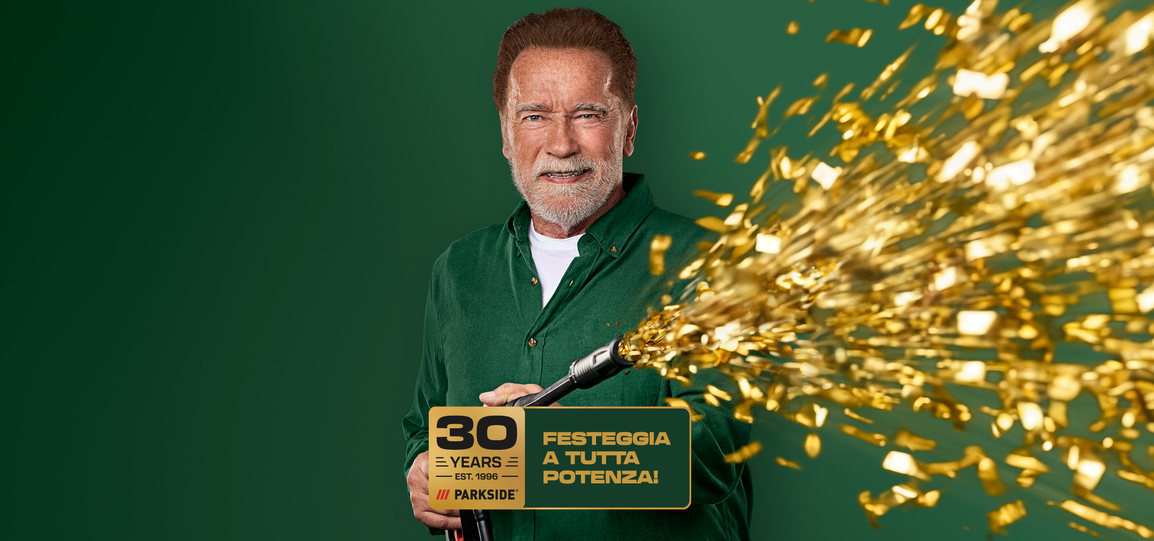 Uomo anziano sorridente con barba grigia che spara coriandoli dorati, con testo '30 YEARS' e 'FESTEGGIA A TUTTA POTENZA!'.