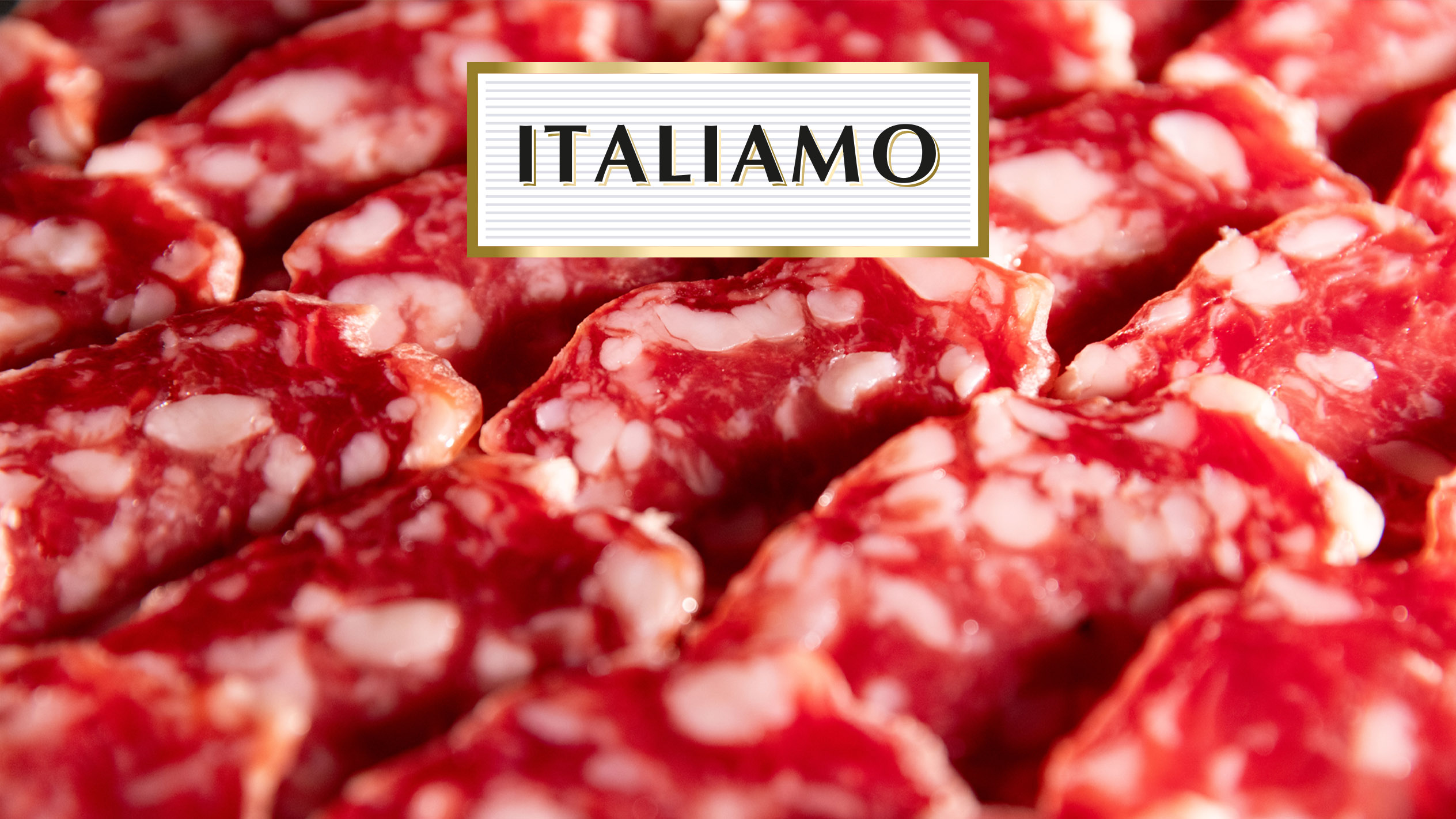 Fette di salame con la scritta 'ITALIAMO'.